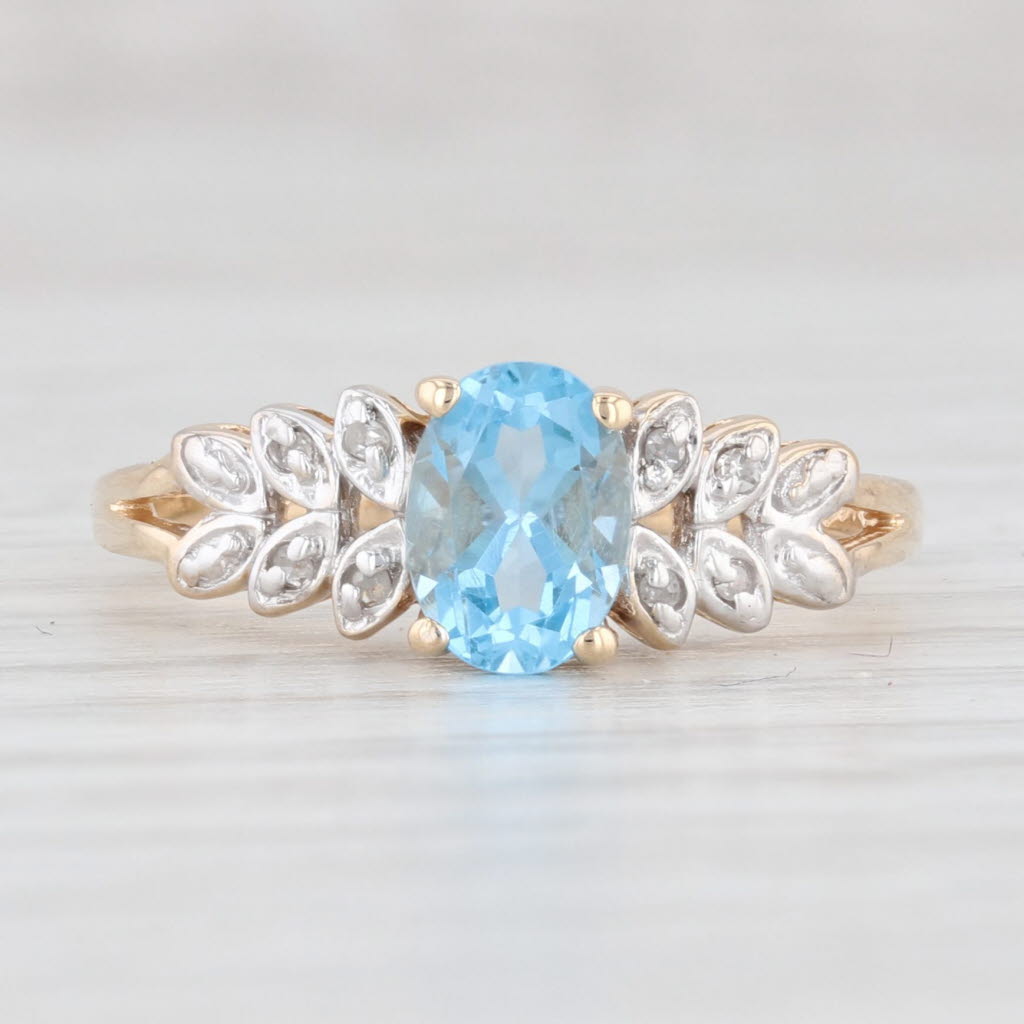 Light Gray 0.99ctw Oval Blue Topaz Diamond Ring 14k Yellow Gold Size 7