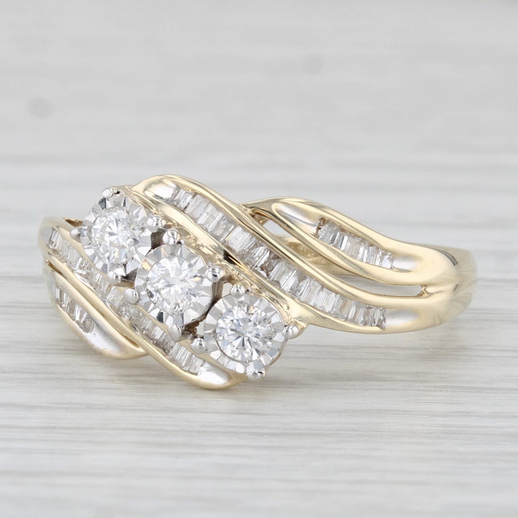 Light Gray 0.53ctw Round 3-Stone Diamond Bypass Ring 10k Yellow Gold Size 7