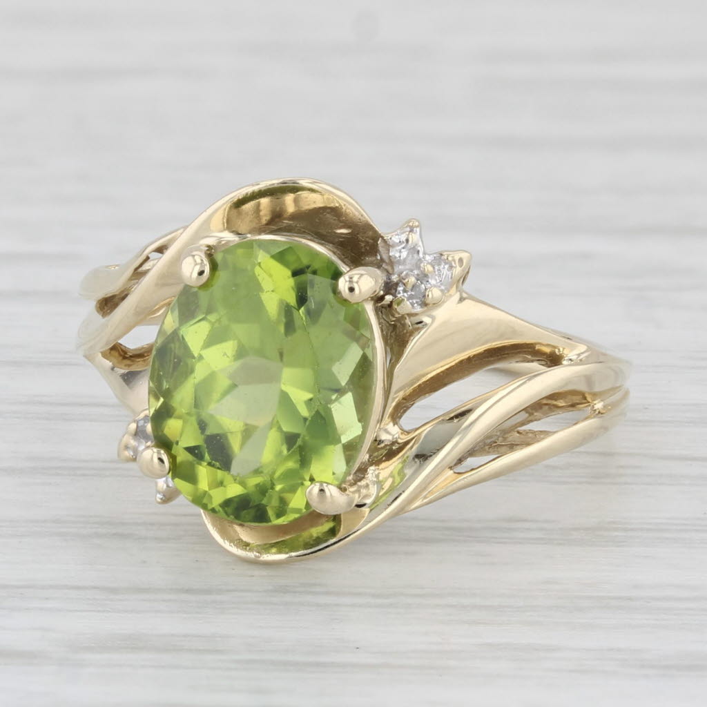 Light Gray 3.08ctw Oval Peridot Ring 10k Yellow Gold Size 7.5 Diamond Accents