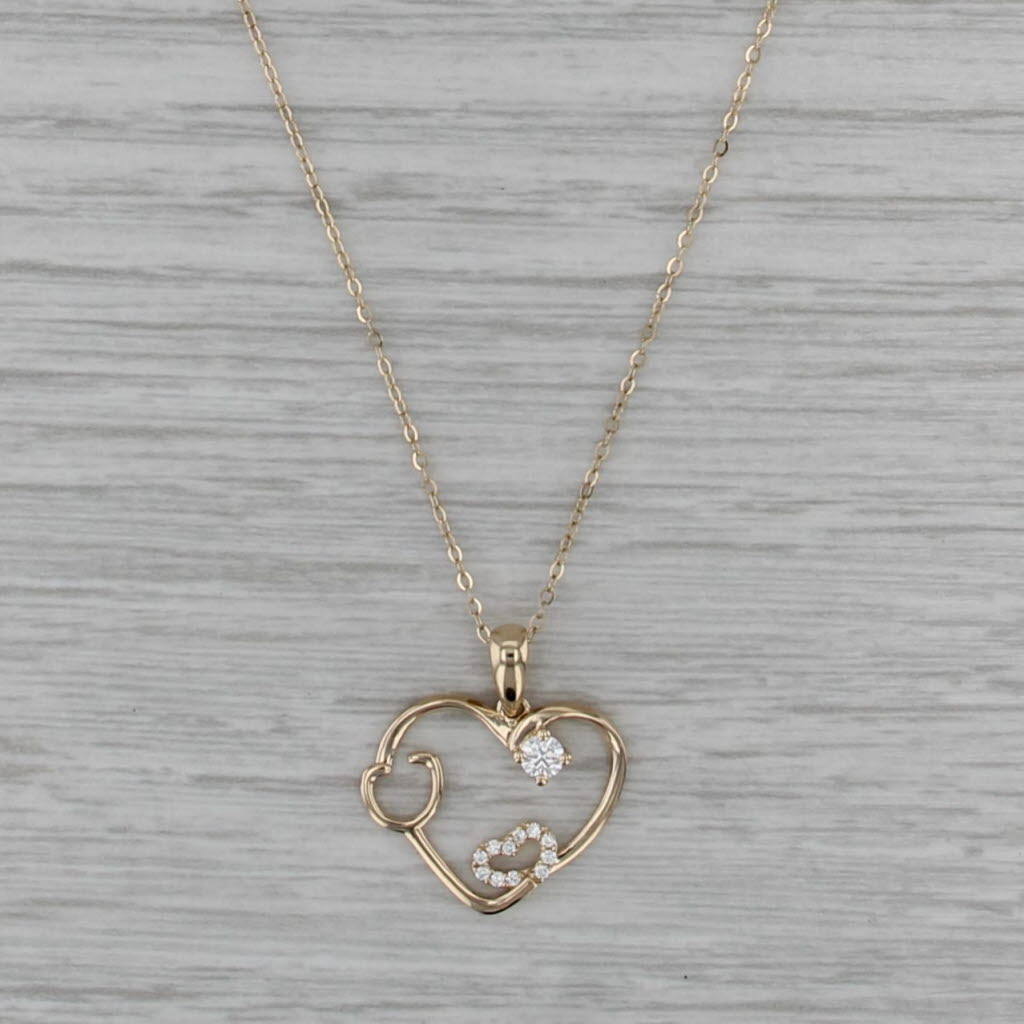0.15ctw Moissanite Stethascope Heart Pendant 14k Yellow Gold 16-18" Cable Chain