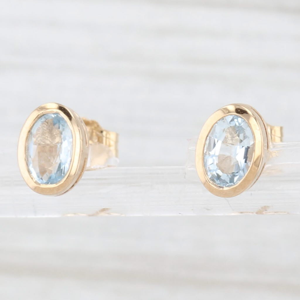 Light Gray 0.80ctw Aquamarine Stud Earrings 14k Yellow Gold Oval Solitaires