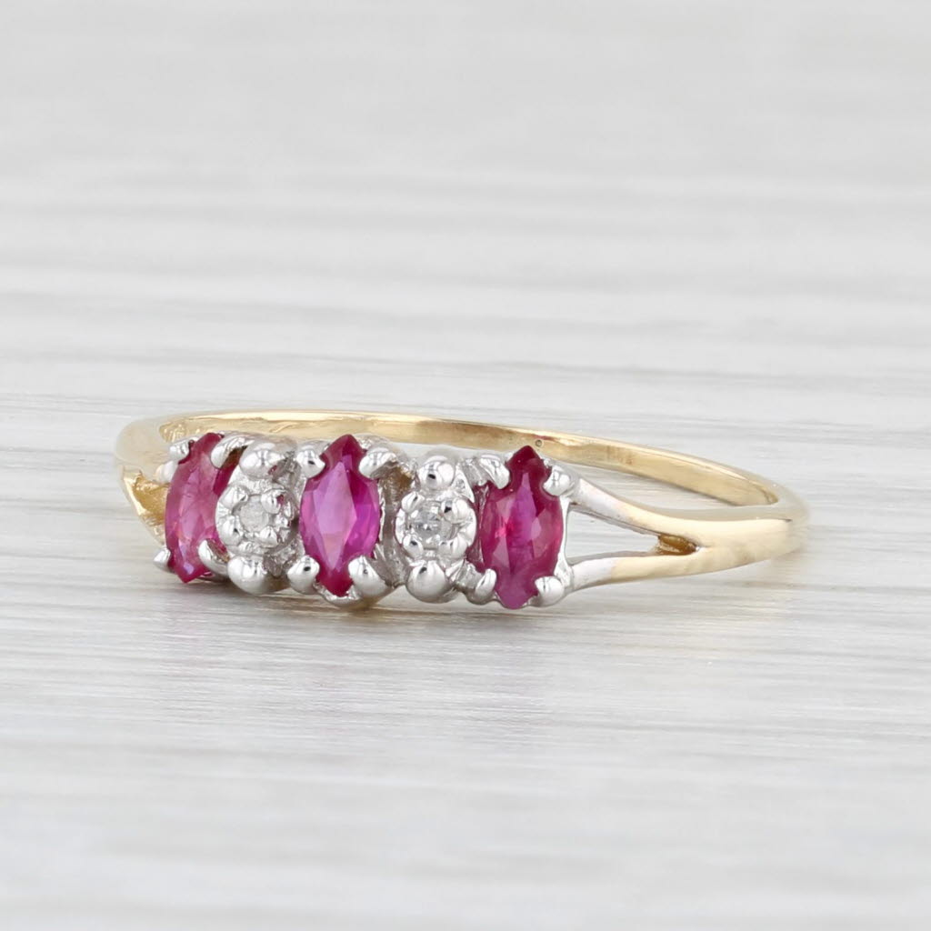 Light Gray 0.30ctw Marquise Ruby 3-Stone Ring 10k Yellow Gold Size 5.25 Diamond Accents