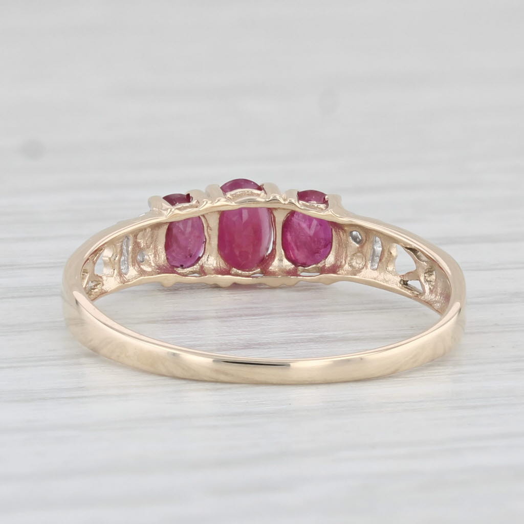 Light Gray 0.78ctw Oval 3-Stone Ruby Ring 10k Yellow Gold Size 7.25 Diamond Accents