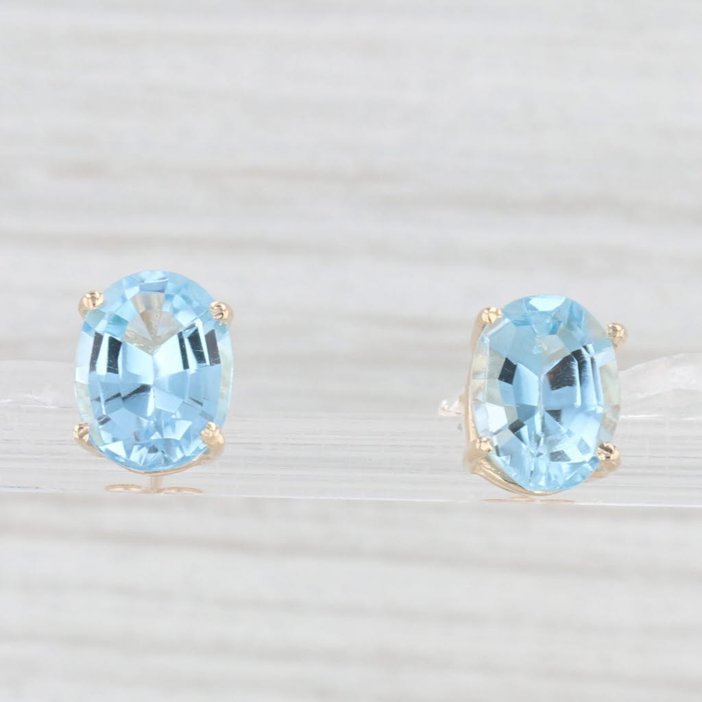 Light Gray 6.60ctw Oval Blue Topaz Solitaire Stud Earrings 14k Yellow Gold