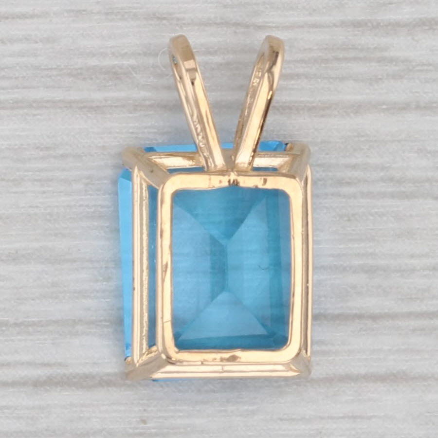 Gray 4.25ct Blue Topaz Emerald Cut Solitaire Pendant 14k Yellow Gold