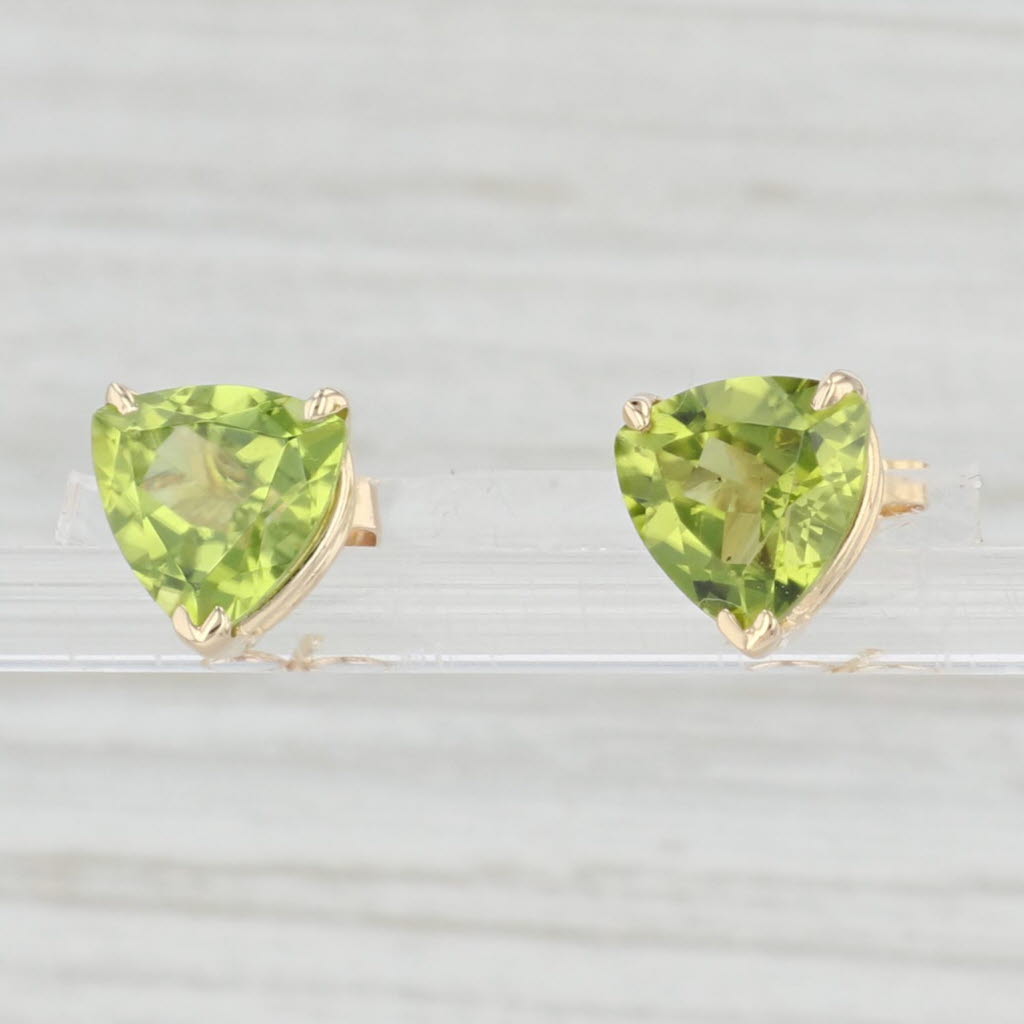 Light Gray 3.20ctw Green Peridot Stud Earrings 14k Yellow Gold Trillion Cut Studs