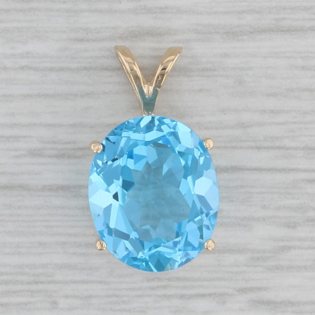 Gray 6ct Oval Blue Topaz Solitaire Pendant 14k Yellow Gold