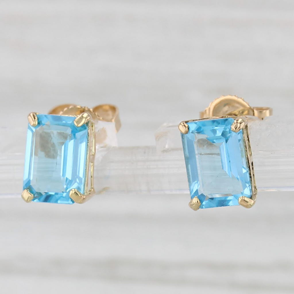 Light Gray 2.08ctw Blue Topaz Emerald Cut Solitaire Stud Earrings 10k Yellow Gold