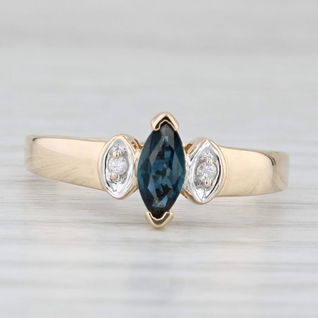 Light Gray 0.34ctw Marquise Blue Sapphire Diamond Ring 10k Yellow Gold Diamond Accents