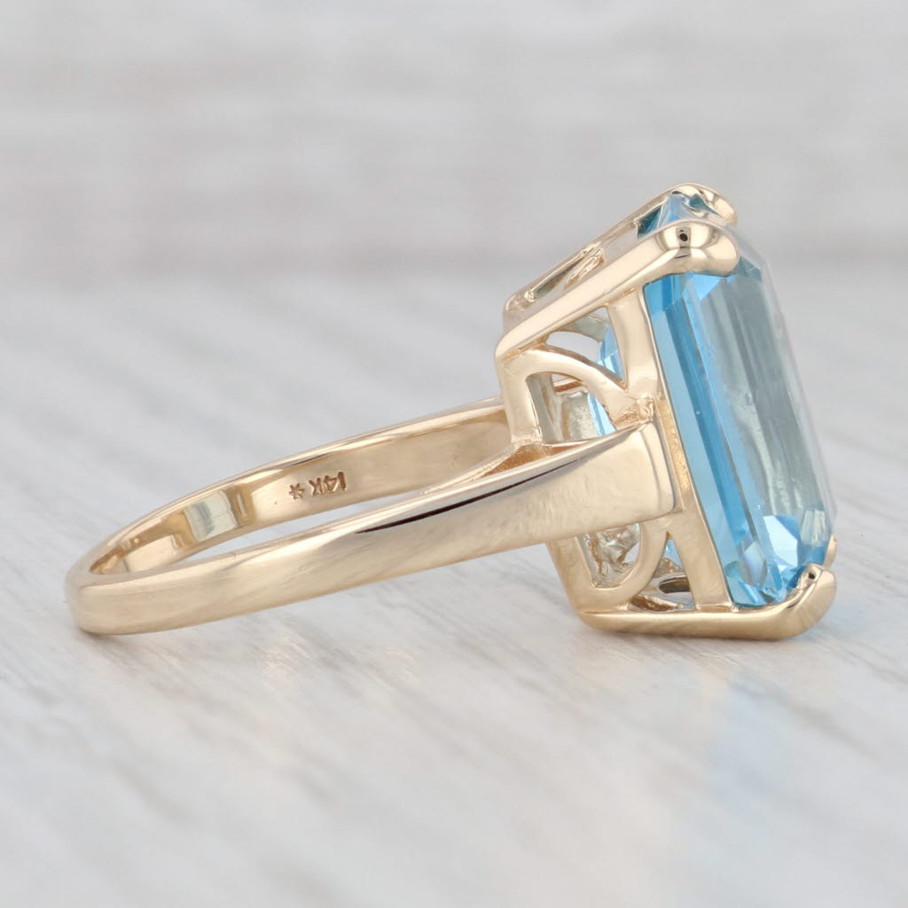 Light Gray 13ct Emerald Cut Blue Topaz Solitaire Ring 14k Yellow Gold Size 7.25