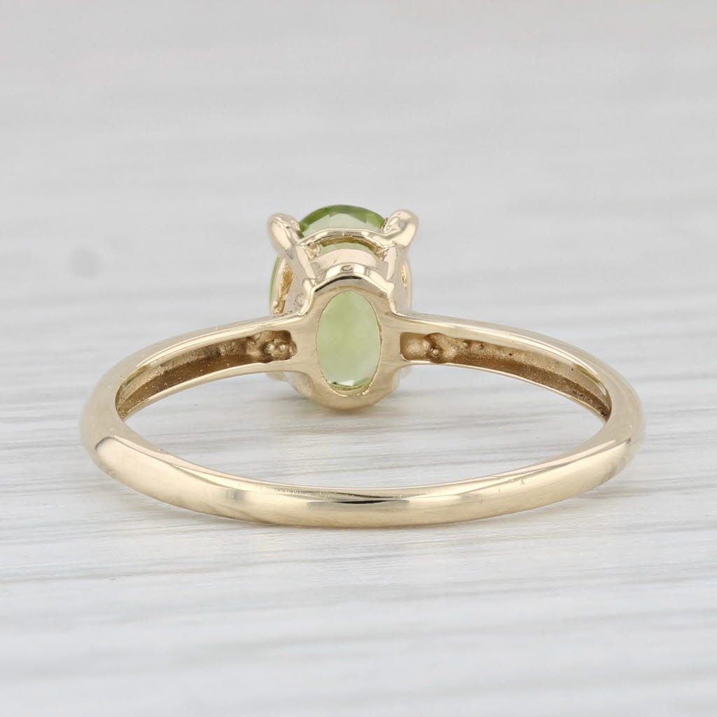 Light Gray 0.85ct Oval Peridot Solitaire Ring 10k Yellow Gold Size 6