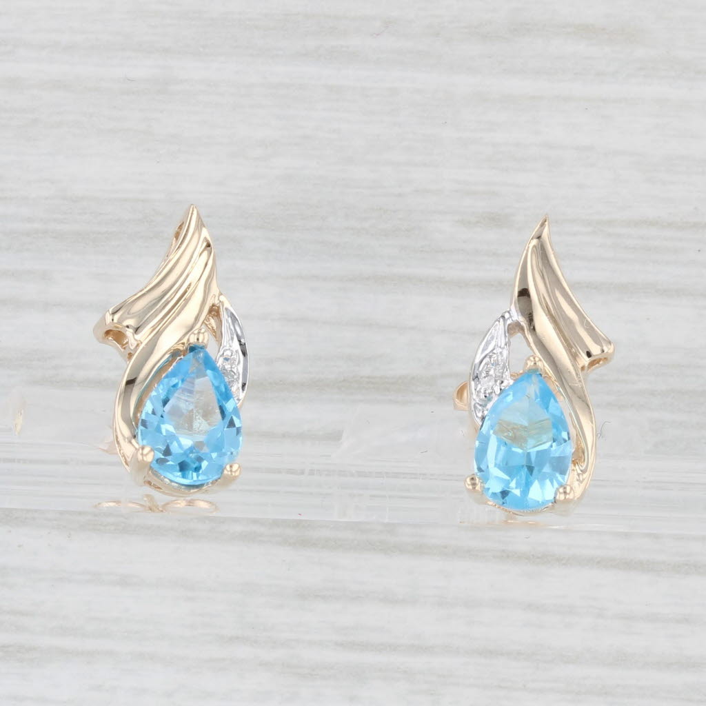 Light Gray 1.60ctw Pear Blue Topaz Diamond Stud Earrings 10k Yellow Gold Diamond Accents