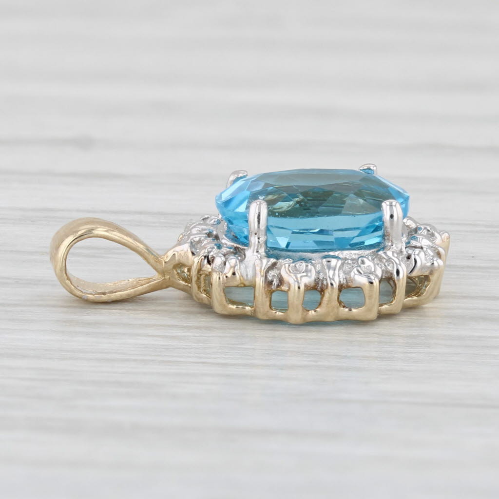 Light Gray 2.25ct Oval Blue Topaz Pendant 10k Yellow Gold Diamond Accents