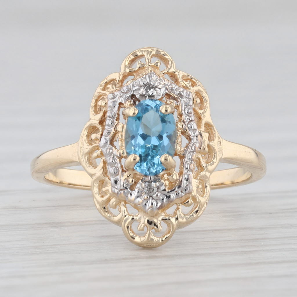 Light Gray 0.60ct Oval Blue Topaz Ring 10k Yellow Gold Size 6 Diamond Accents