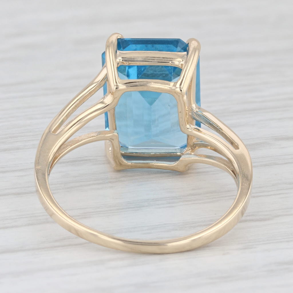 Light Gray 9.10ct Emerald Cut Blue Topaz Solitaire Ring 10k Yellow Gold Size 9