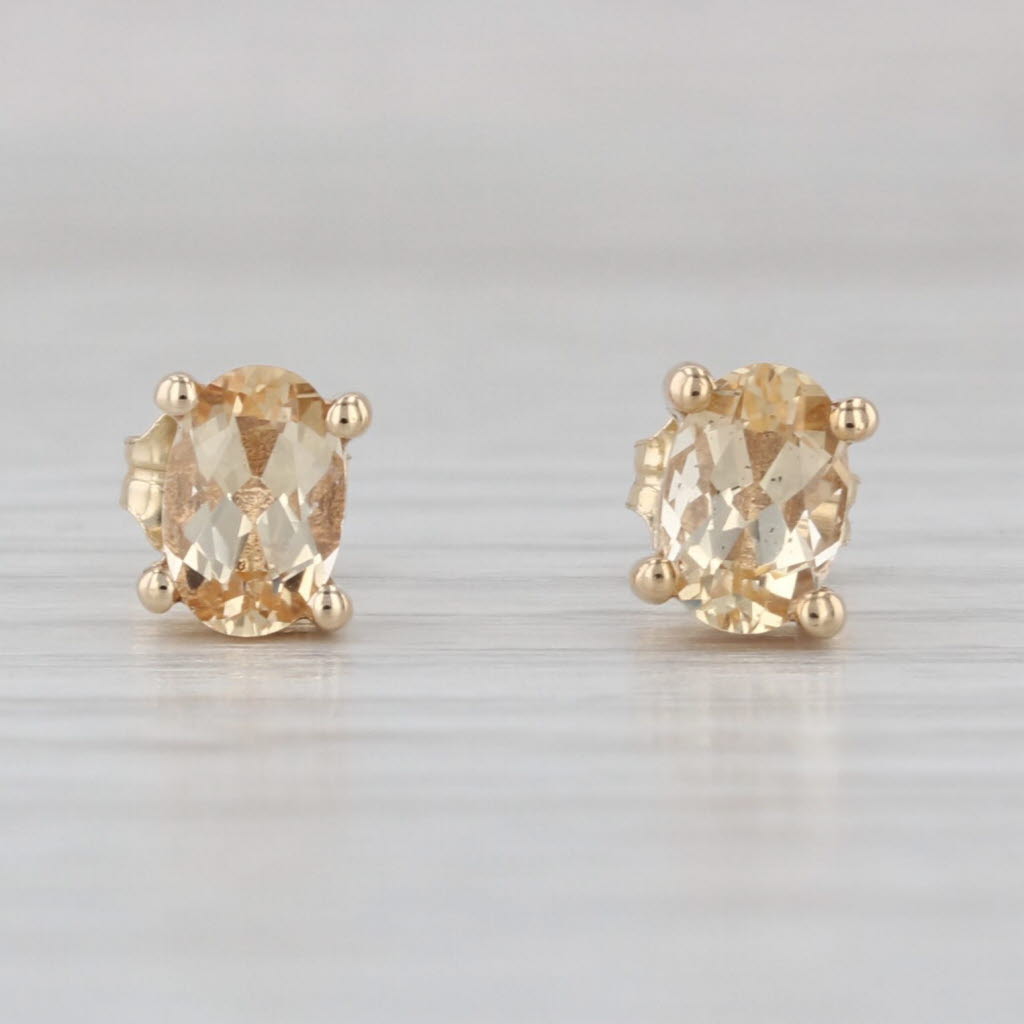 1.07ctw Yellow Topaz Stud Earrings 10k Yellow Gold Oval Solitaire Studs