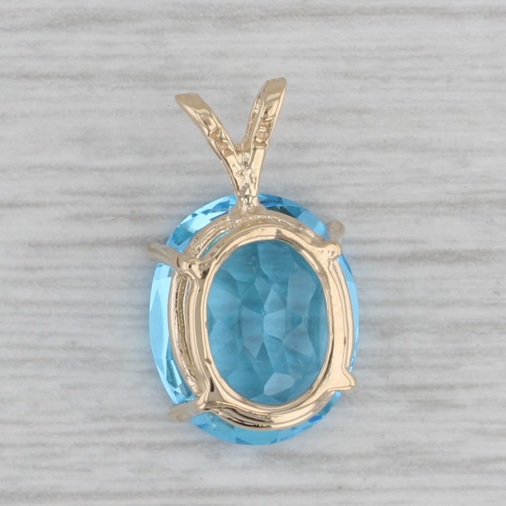 Gray 6ct Oval Blue Topaz Solitaire Pendant 14k Yellow Gold