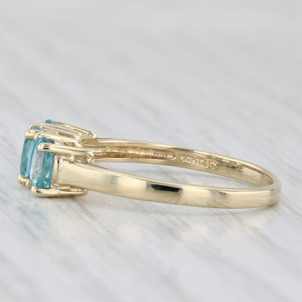 Light Gray 0.90ctw Oval 3-Stone Blue Zircon Ring 10k Yellow Gold Size 7