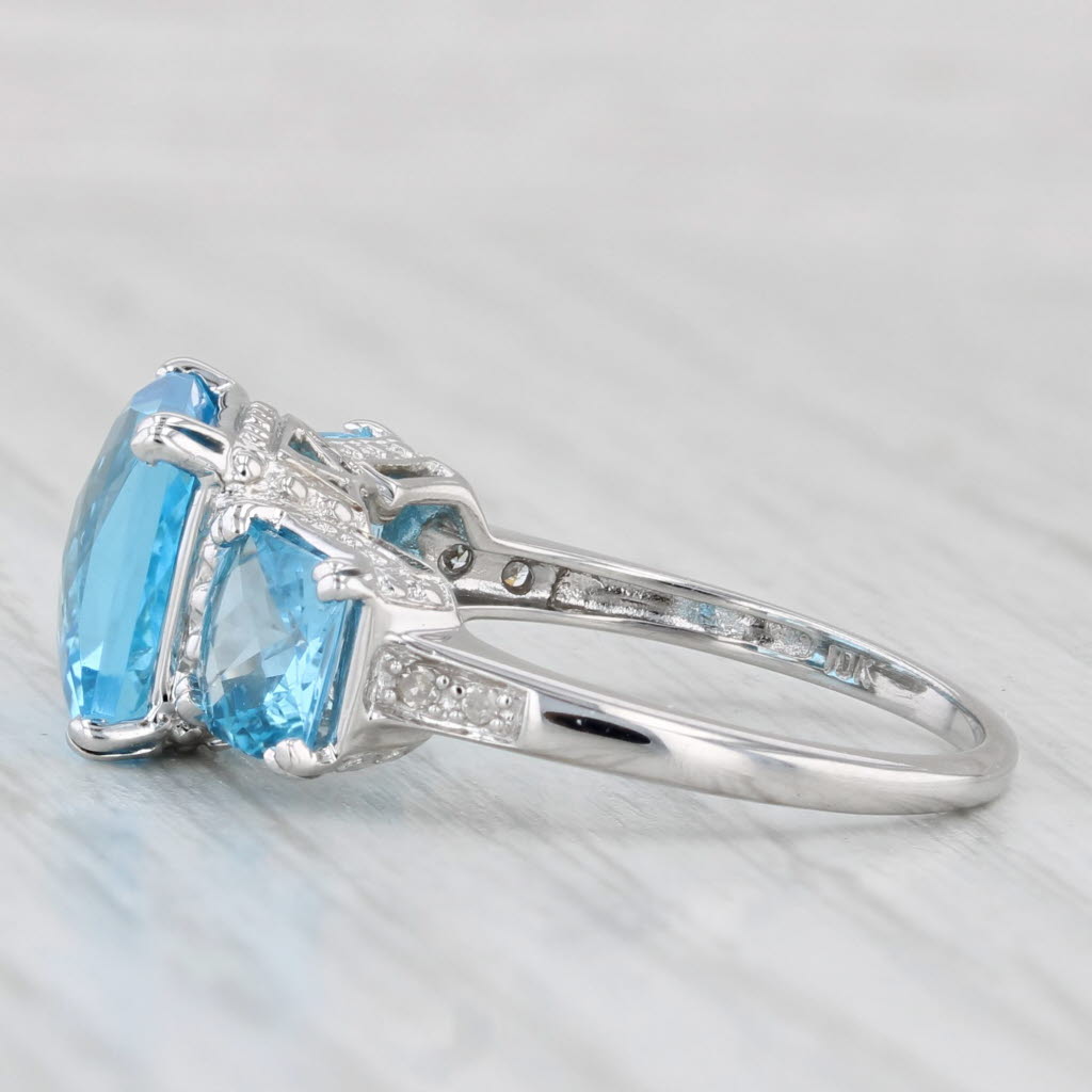 Light Gray 6.37ctw Blue Topaz 3-Stone Ring 10k White Gold Size 7 Diamond Accents