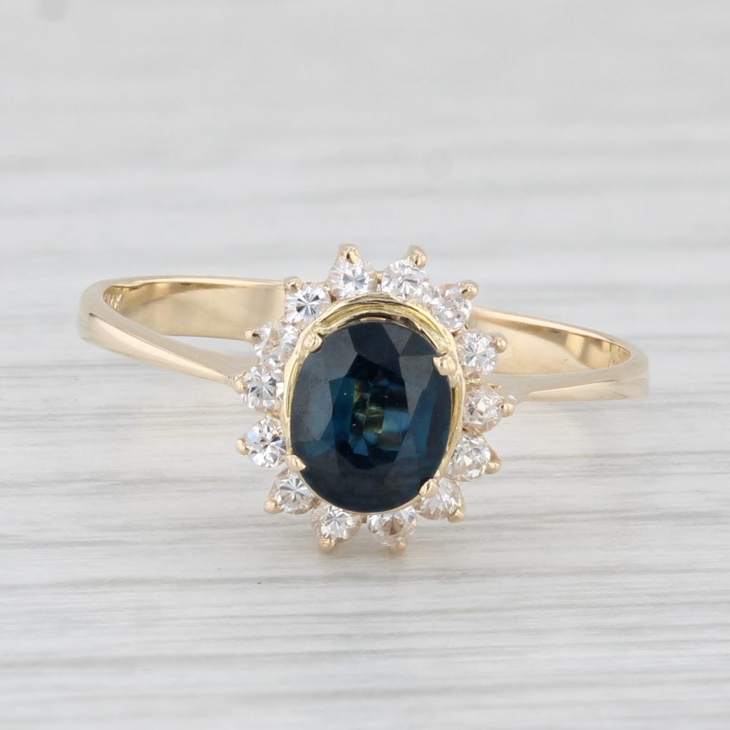 Light Gray 0.97ctw Oval Blue Sapphire Cubic Zirconia Halo Ring 14k Yellow Gold Size 7.5