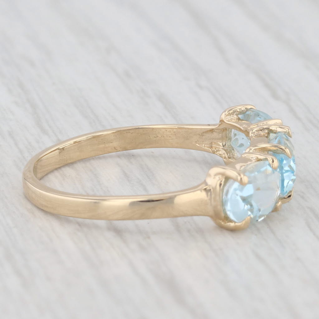 Light Gray 3ctw 3-Stone Oval Blue Topaz Ring 14k Yellow Gold Size 8