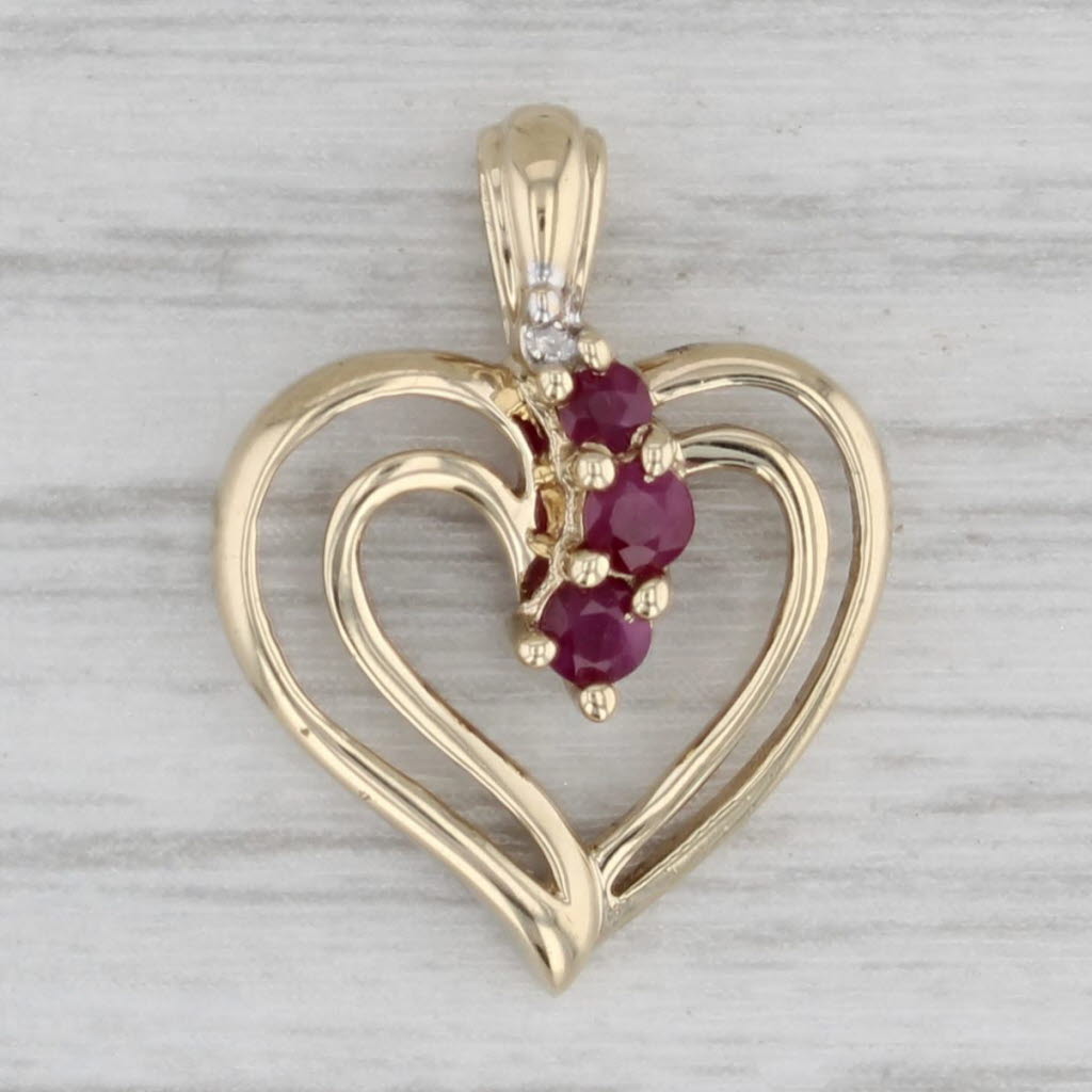 Gray 0.18ctw Ruby Open Heart Pendant 10k Yellow Gold Diamonds