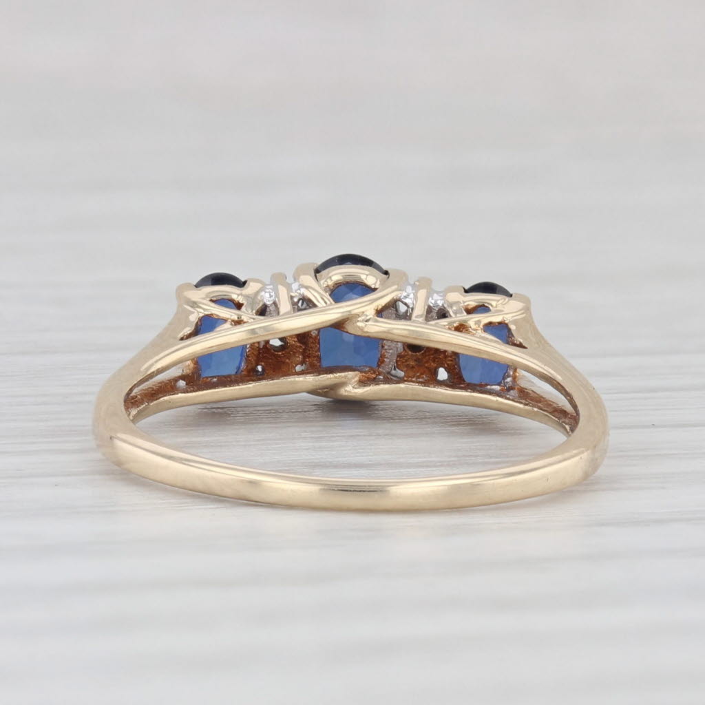 Light Gray 1.20ctw Lab Created Blue Sapphire 3-Stone Ring 10k Yellow Gold Size 7