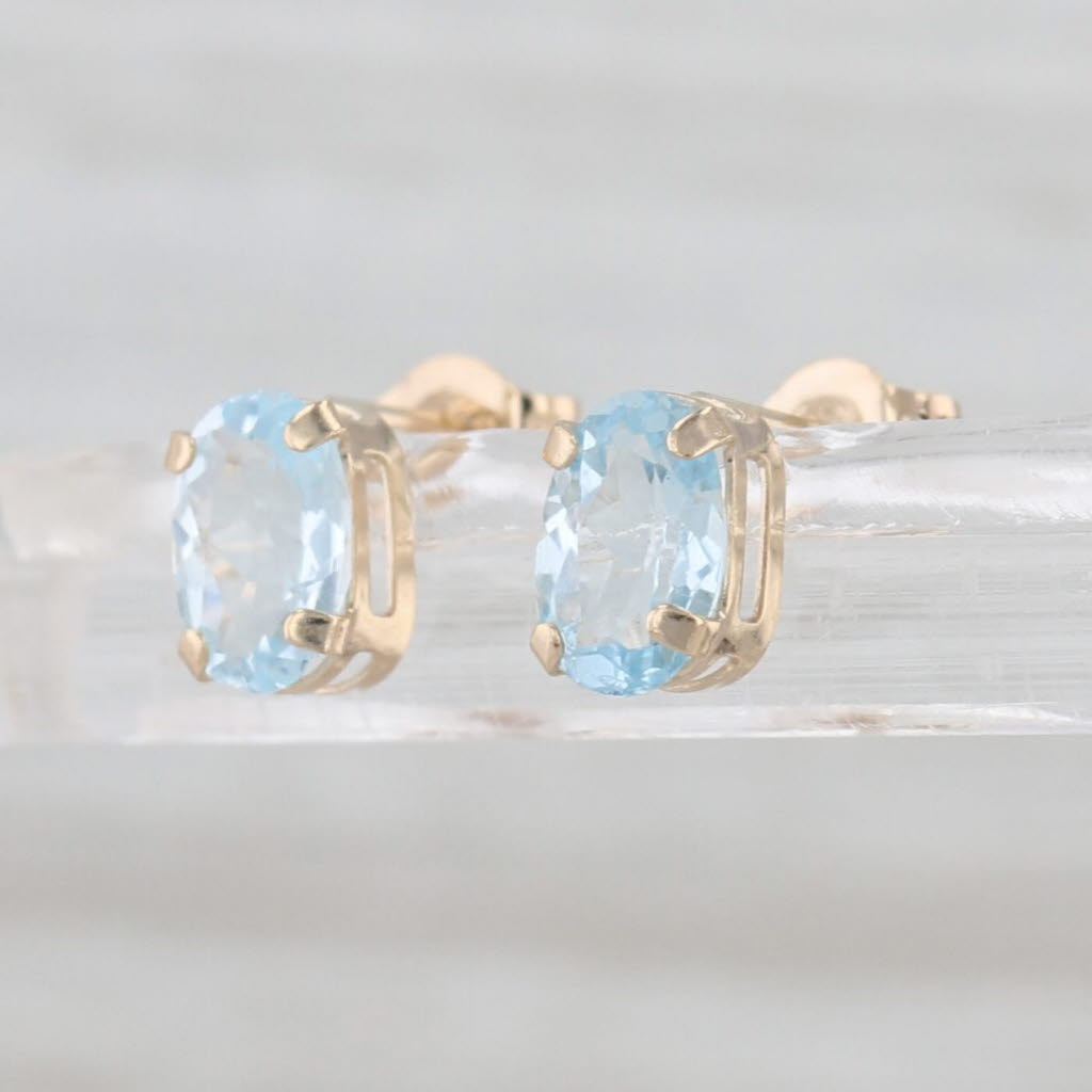 0.90ctw Oval Blue Topaz Stud Earrings 10k Yellow Gold Solitaire Studs