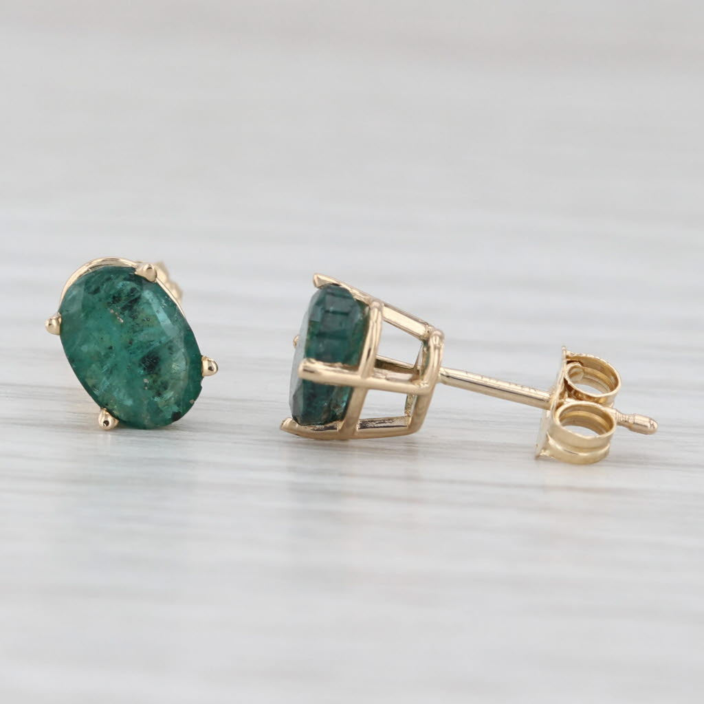 Light Gray 1.40ctw Oval Emerald Solitaire Stud Earrings 14k Yellow Gold