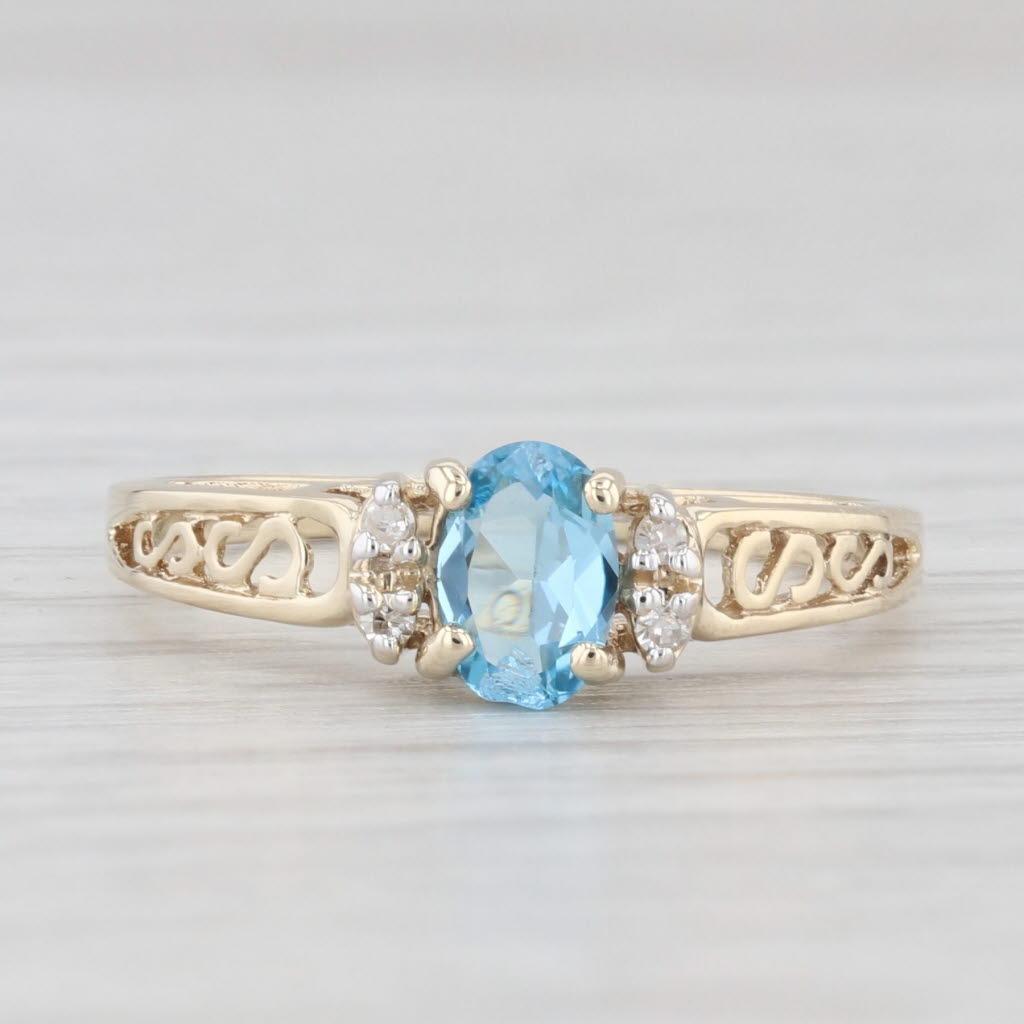 Light Gray 0.44ctw Oval Blue Topaz Diamond Ring 10k Yellow Gold Size 6