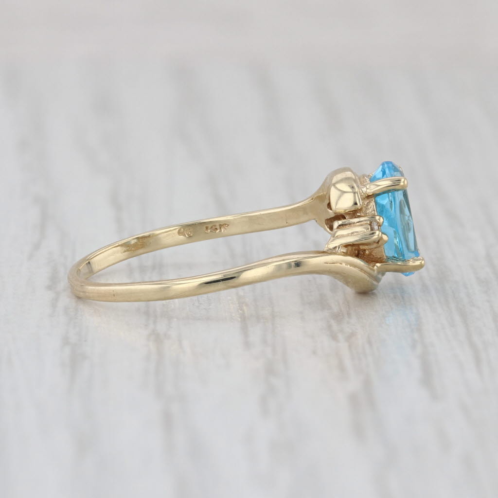 1.53ctw Oval Blue Topaz Diamond Bypass Ring 14k Yellow Gold Size 7.75