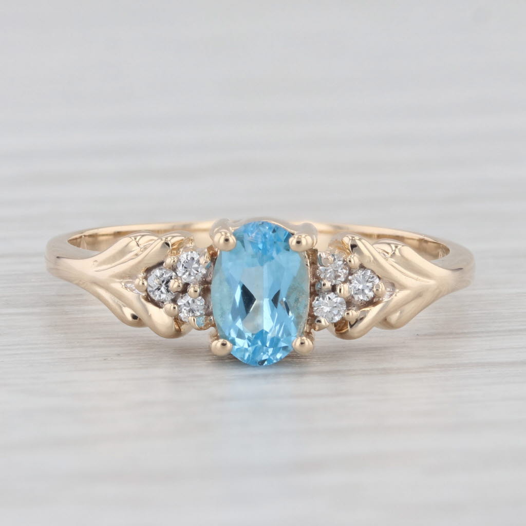 Light Gray 0.60ctw Oval Blue Topaz Diamond Ring 14k Yellow Gold Size 6.25