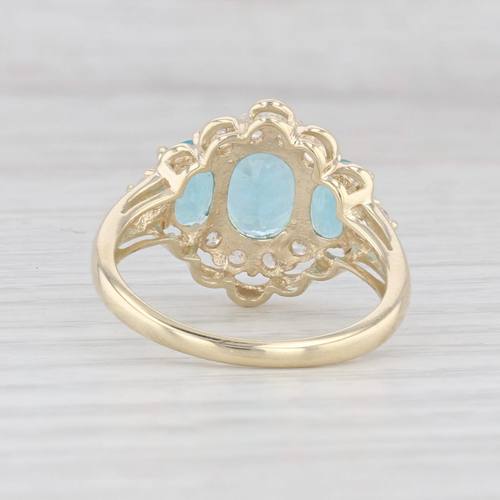 Light Gray 2.31ctw Blue Apatite 3-Stone Cubic Zirconia Ring 10k Yellow Gold Size 7