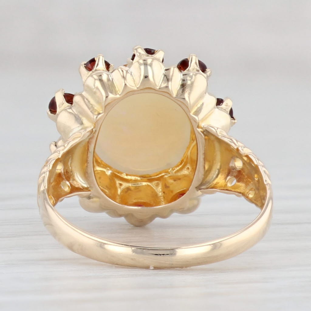 Light Gray 0.80ctw Garnet Halo Opal Ring 10k Yellow Gold Size 6