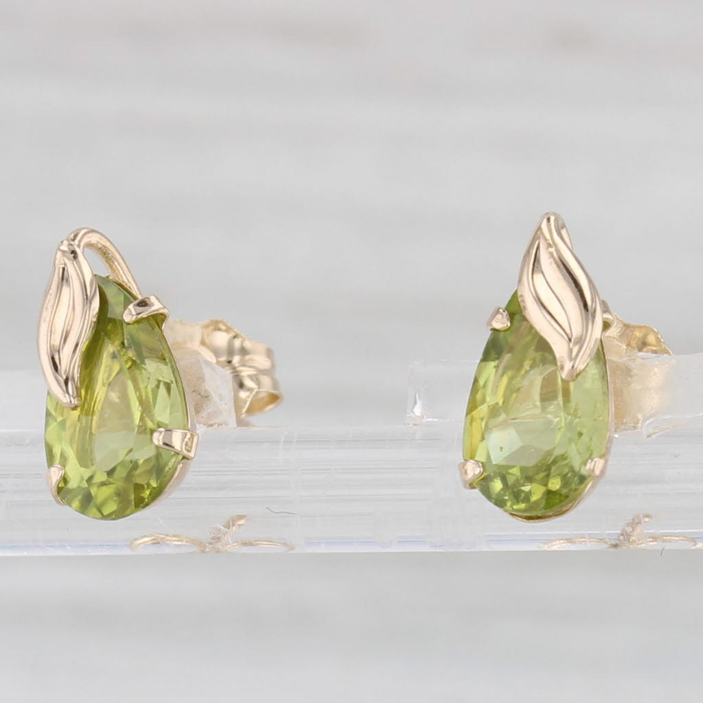 Light Gray 1.80ctw Peridot Pear 10k Yellow Gold Stud Earrings