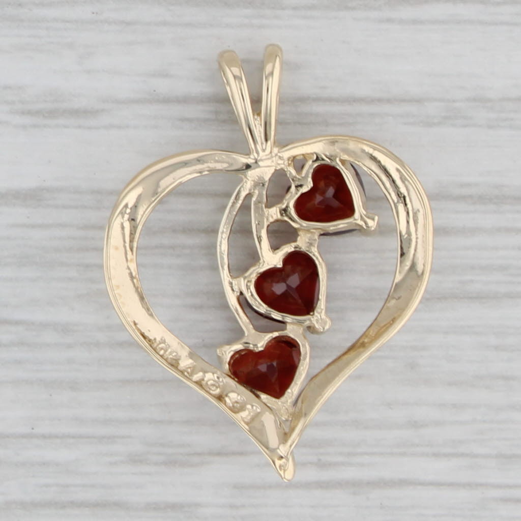 Gray 1.20ctw Garnet Hearts Open Heart Pendant 10k Yellow Gold