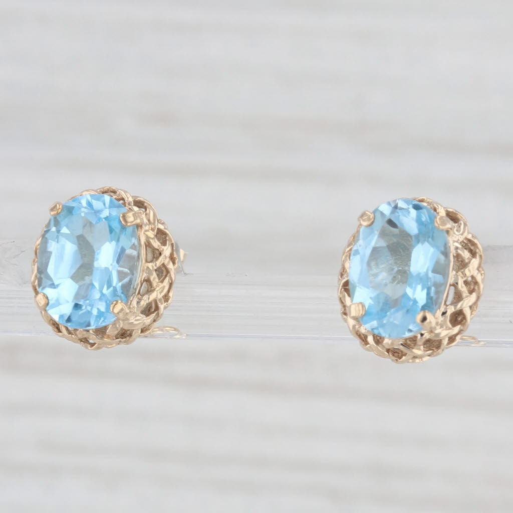 Light Gray 2.80ctw Oval Solitaire Blue Topaz Stud Earrings 10k Yellow Gold