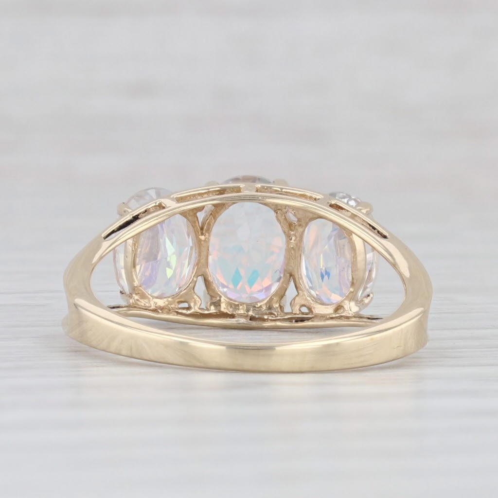 Light Gray 3.50ctw Oval Mystic Topaz 3-Stone Ring 10k Yellow Gold Size 7