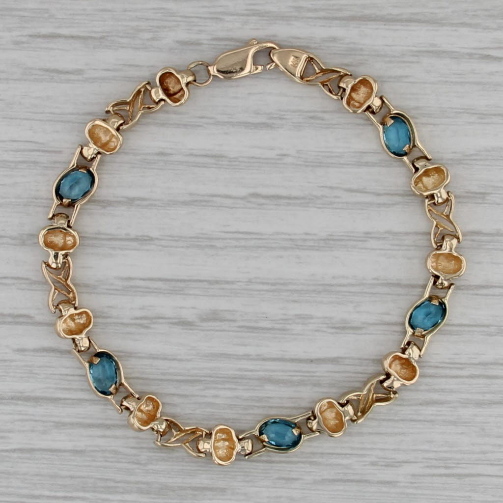 2.68ctw Blue Topaz Infinity Knot Bracelet 14k Yellow Gold 6.75" 6mm