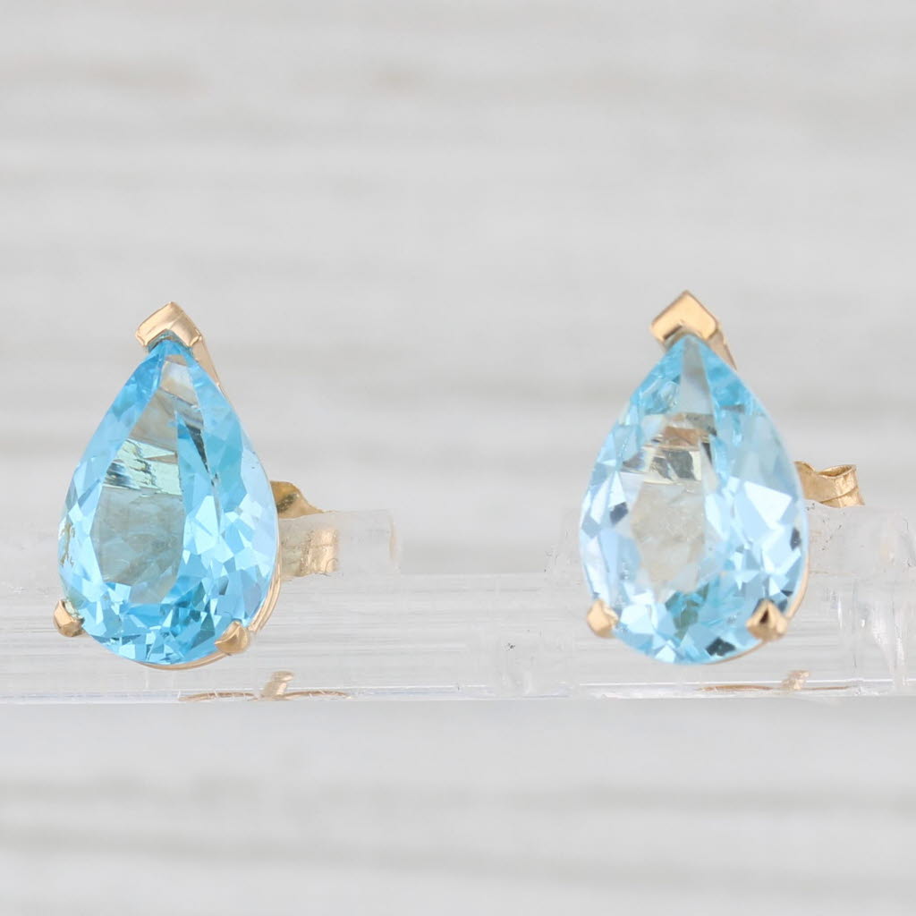 Light Gray 4.70ctw Pear Solitaire Blue Topaz Stud Earrings 14k Yellow Gold