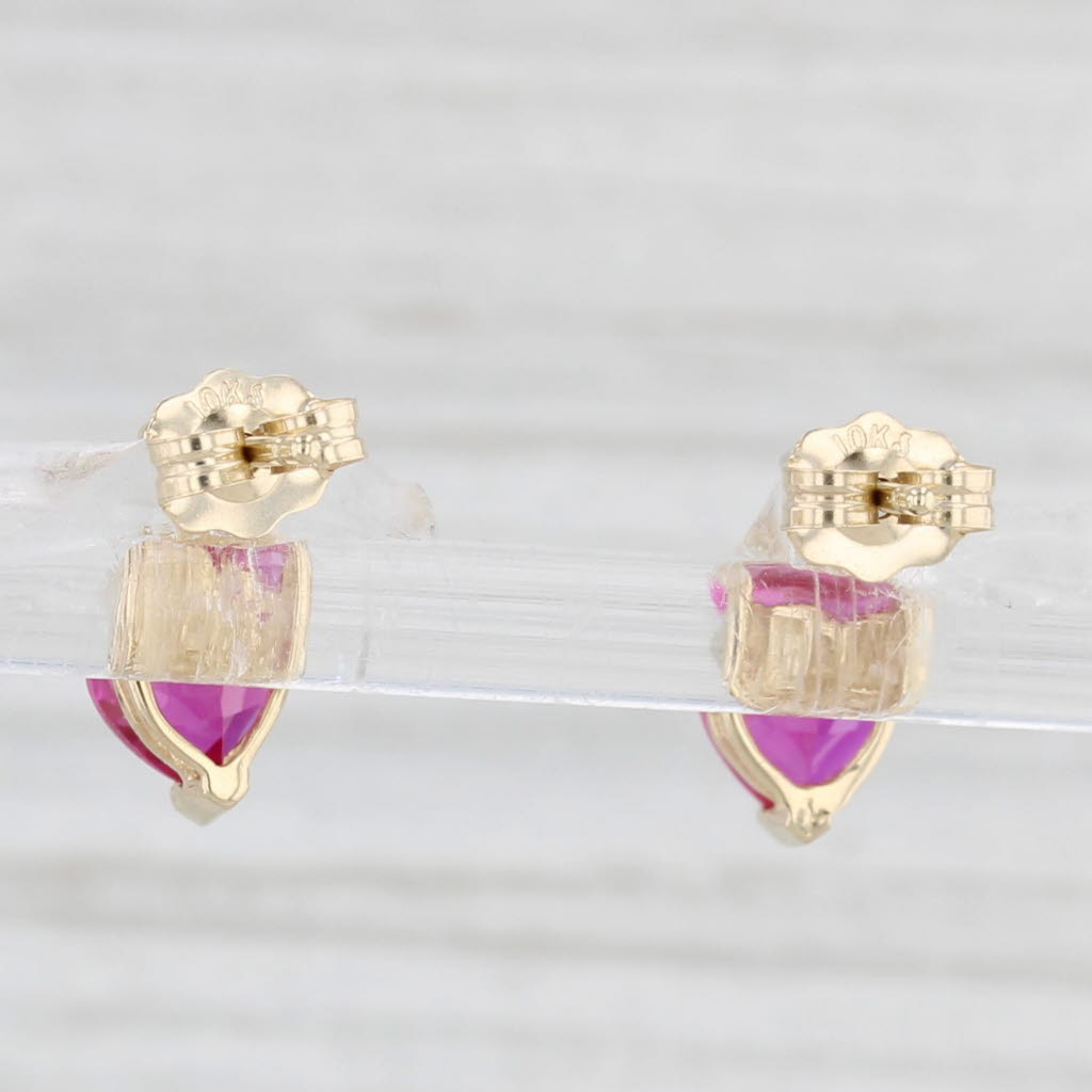 Light Gray 1.20ctw Lab Created Ruby Heart Stud Earrings 10k Yellow Gold