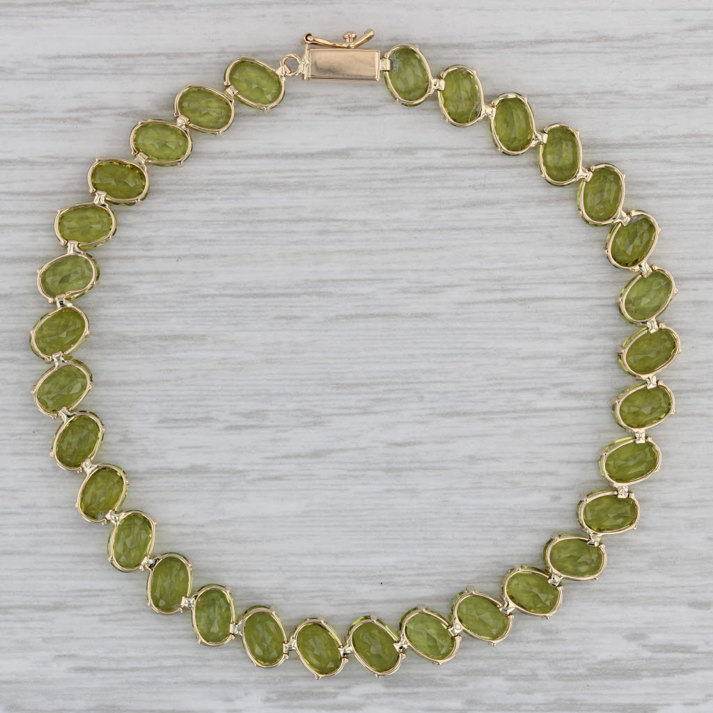 Gray 27ctw Peridot Tennis Bracelet 14k Yellow Gold 8" 7.1mm