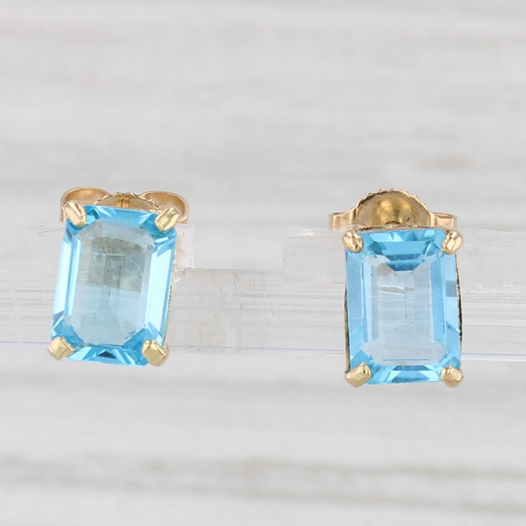 Light Gray 2.08ctw Blue Topaz Emerald Cut Solitaire Stud Earrings 10k Yellow Gold