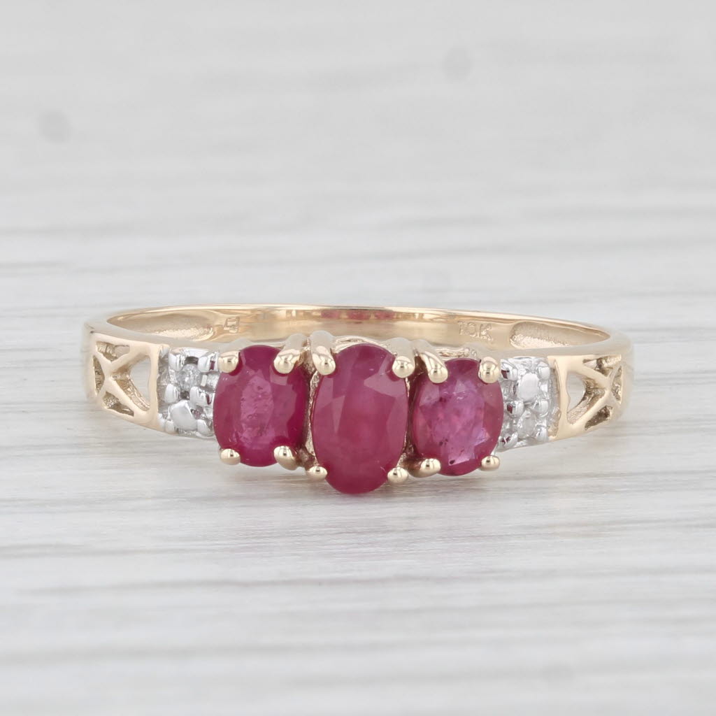 Light Gray 0.78ctw Oval 3-Stone Ruby Ring 10k Yellow Gold Size 7.25 Diamond Accents