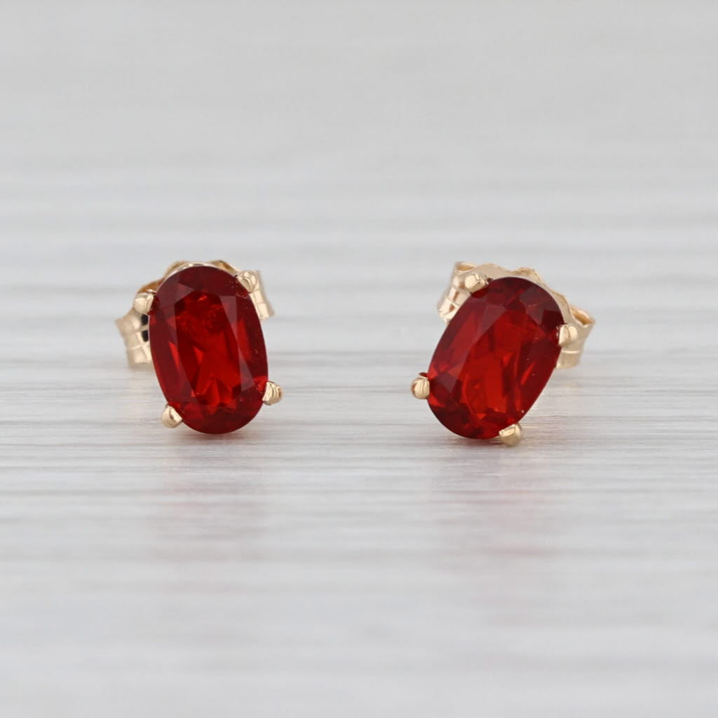 0.56ctw Fire Opal Stud Earrings 14k Yellow Gold Oval Solitaire Studs