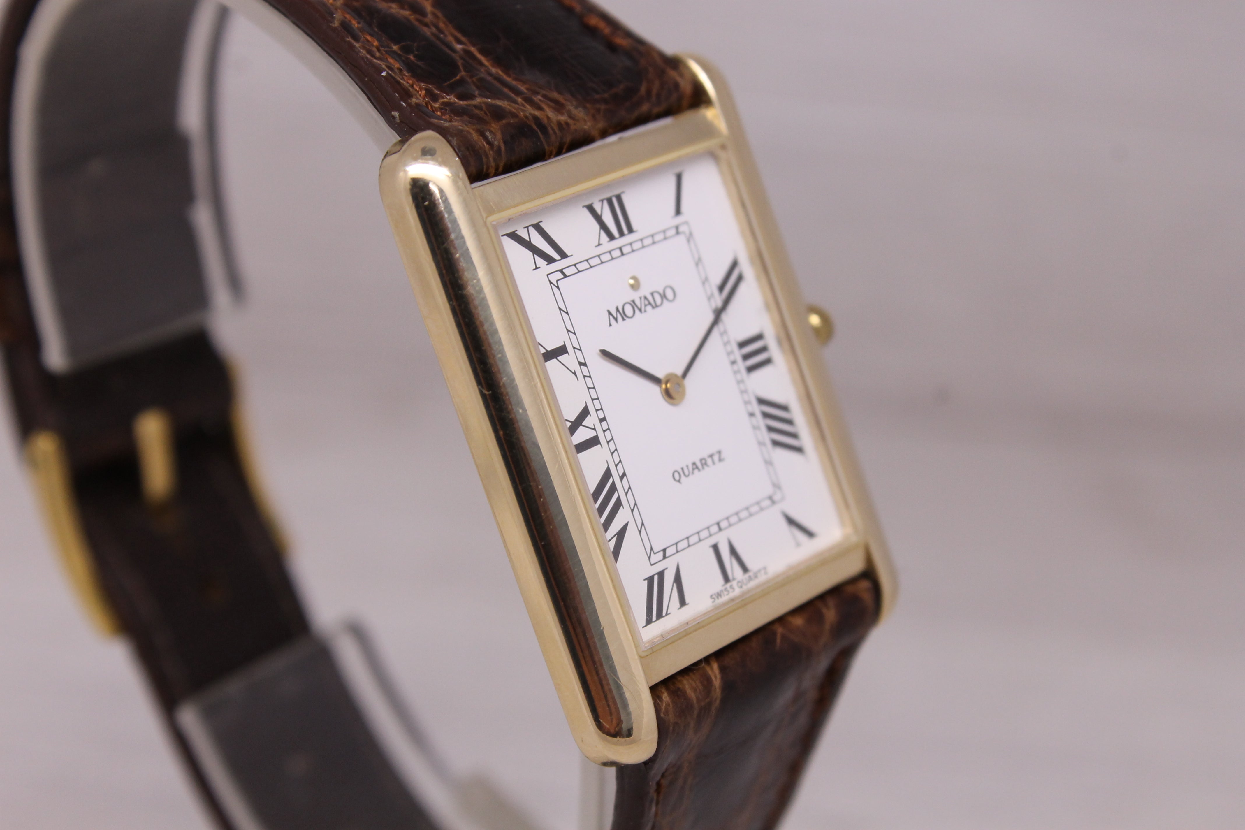 Vintage c.1990 Movado 14k Yellow Gold 25mm Tank Dress Watch Quartz Roman Dial