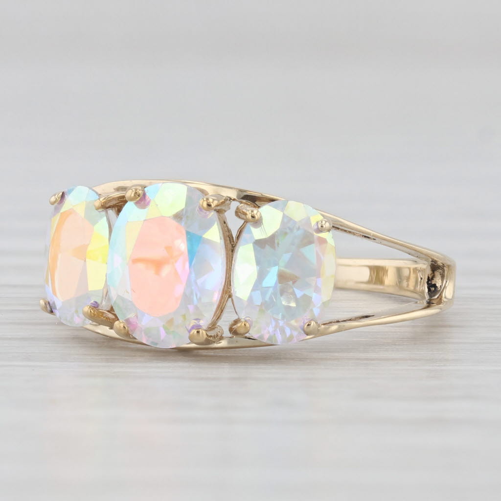 Light Gray 3.50ctw Oval Mystic Topaz 3-Stone Ring 10k Yellow Gold Size 7