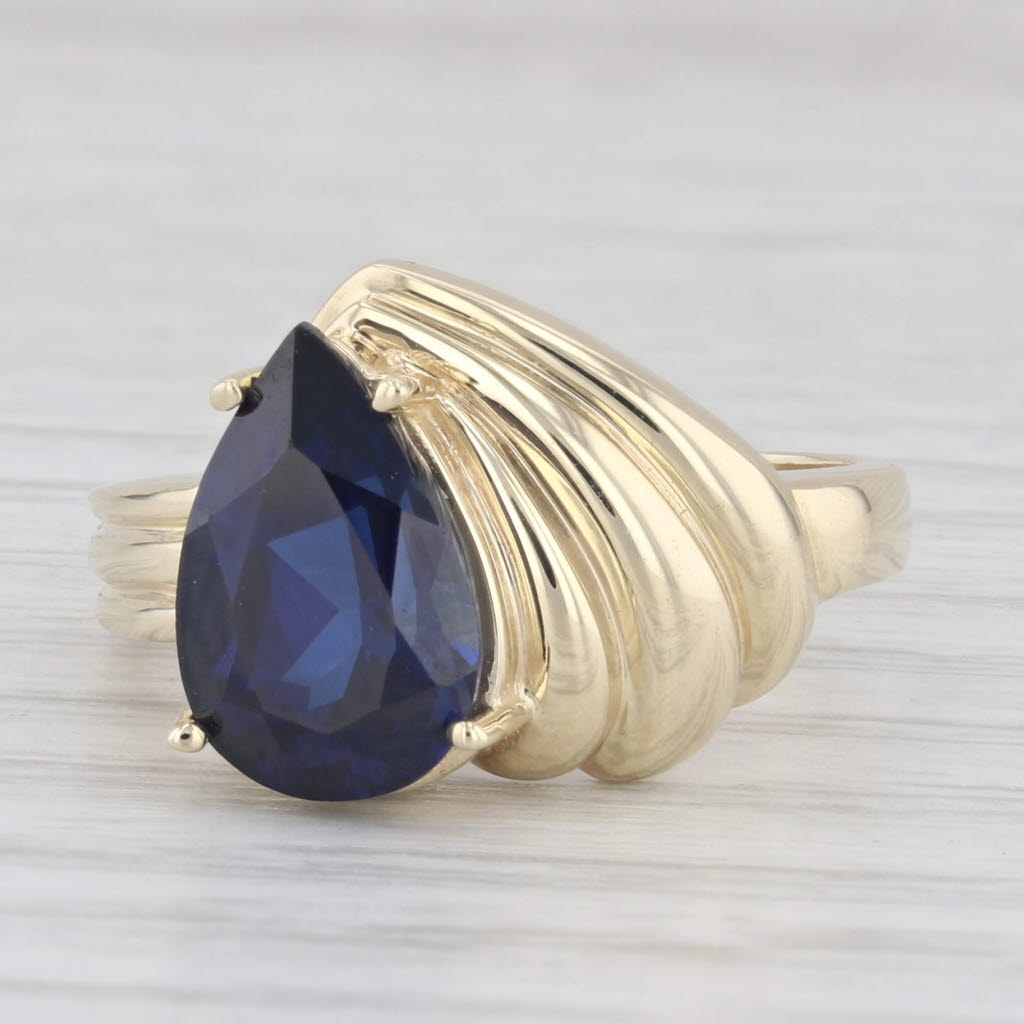 Light Gray 4.30ctw Lab Created Pear Blue Sapphire 10k Yellow Gold Size 8 Ring