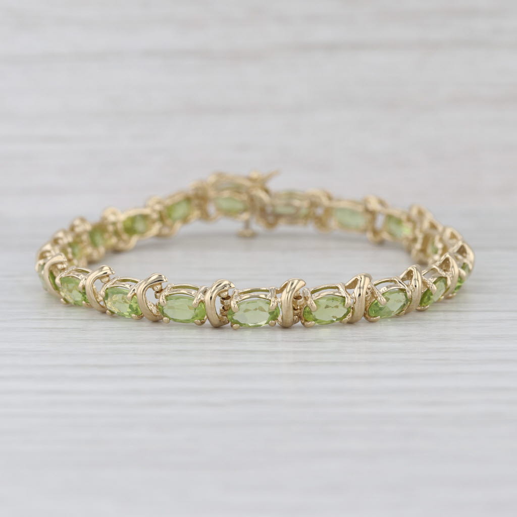 10ctw Light Green Peridot Tennis Bracelet 14k Yellow Gold 6.75" 6.4mm
