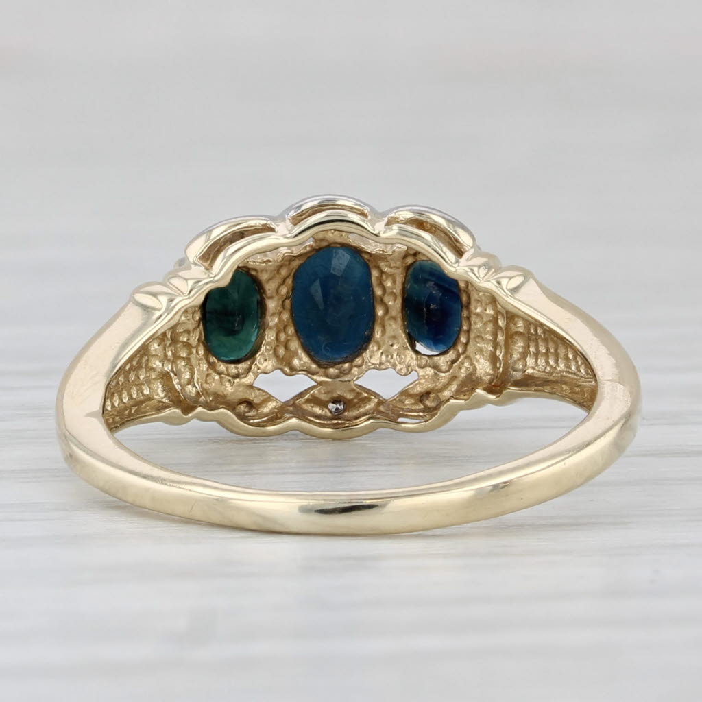 Light Gray 1.10ctw Blue Sapphire Oval 3-Stone Ring 10k Yellow Gold Diamond Accents Size 7.5